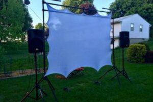 Movie screen outdoors on stands